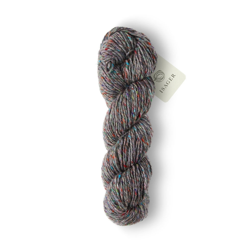 Grauer Grundton mit bunten Tweed-Einsprengseln – lebhaft & rustikal.